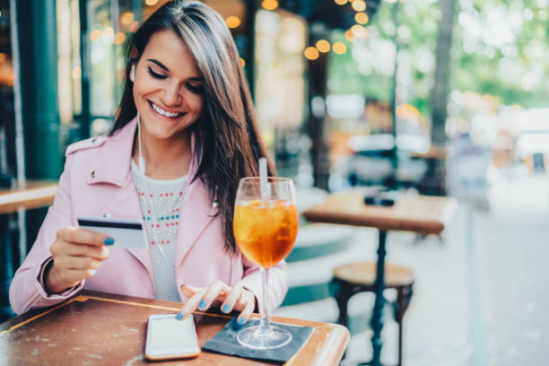 istock Woman in cafe online shopping 2060763470