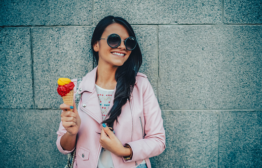 Young woman enjoying an ice-cream