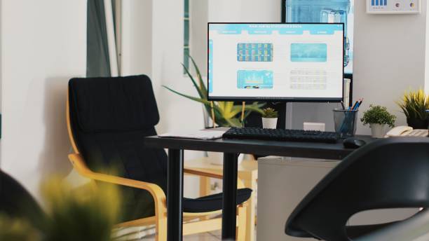 istock Computer screen on brokerage firm office desk showing volatile stock exchange 2060767845