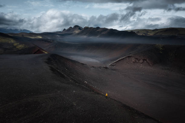 istock Man On Top Of The Crater 2060782310
