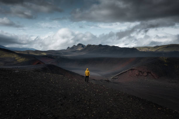 istock Man On Top Of The Crater 2060782311