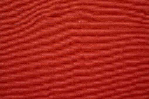 Dark red cotton fabric cloth texture for background, natural textile pattern.