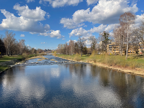 View of the Ostravice River in the Frydek-Mistek area on a sunny day.