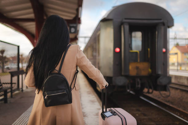istock Young businesswoman boarding a train 2060806022