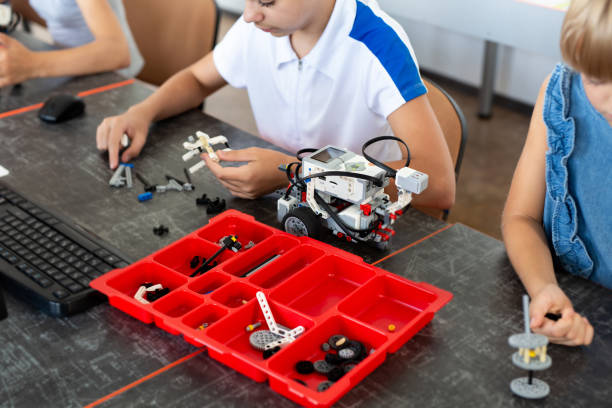 istock Cheerful kids working on the tech project at school. 2060809249