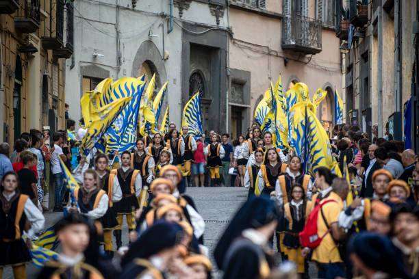 Viterbo, Lazio, Italy - 3 September 2019:The celebrations in honor of Santa Rosa reach their climax. September 3rd is the longest, most intense, spectacular and exciting day. It starts at 2pm with the meeting between the porters and the municipal administrators. Then the traditional visit to the churches: the so-called tour of the seven churches, accompanied by the Vejano musical band.Musical bands and flag-wavers precede the Santa Rosa porters' parade, once the parades are over you will witness a unique event in the world.The triumphal transport of the Santa Rosa car.
