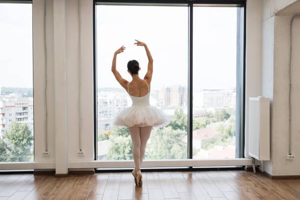 istock Focused young Caucasian ballerina dressed in white tutu costume. 2060813459