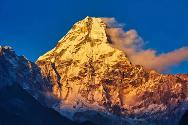Gorgeous Ama Dablam is bathed in a golden sunset as seen from the scenic village of Pangboche in the upper Khumbu, Nepal