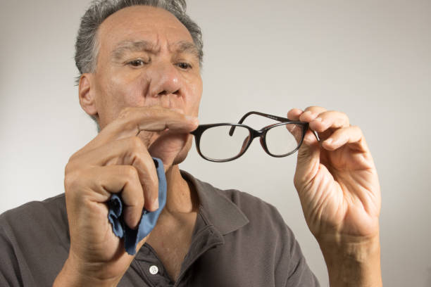 istock Man cleaning  his glasses 2060823660