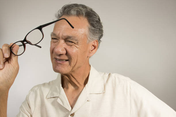 istock Man cleaning  his glasses 2060825235