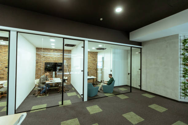istock Focused work in a modern glass-walled office 2060828445