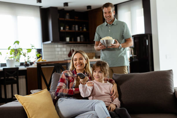 istock Family Movie Night: Engrossed in Thrilling Scenes at Home 2060831680