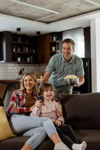 istock Family Movie Night: Engrossed in Thrilling Scenes at Home 2060832220