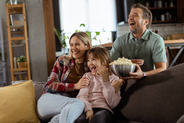 istock Family Movie Night: Engrossed in Thrilling Scenes at Home 2060832231