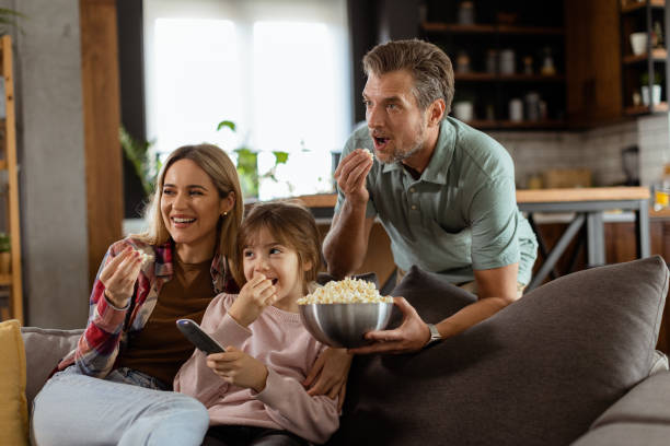 istock Family Movie Night: Engrossed in Thrilling Scenes at Home 2060836037
