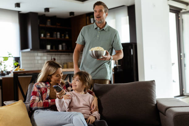 istock Family Movie Night: Engrossed in Thrilling Scenes at Home 2060836041