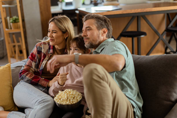 istock Family Movie Night: Engrossed in Thrilling Scenes at Home 2060836056