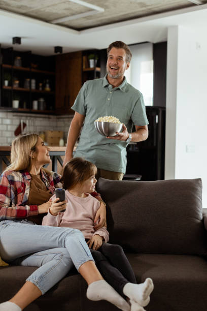 istock Family Movie Night: Engrossed in Thrilling Scenes at Home 2060836568