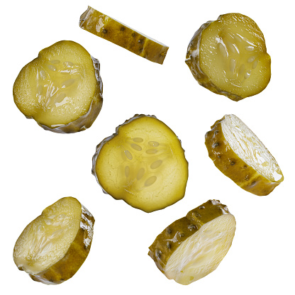 pickled cucumber slices flying isolated on whhite background