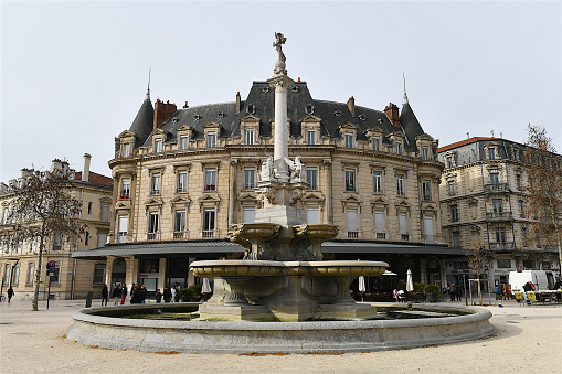 Valence, France-02 21 2024: The Monumental Fountain located in the old town of Valence, France, was designed by sculptor E.Poitoux and  inaugurated in 1887.
