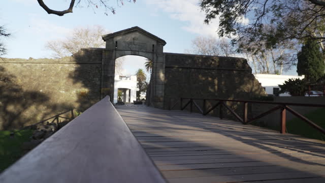 Wooden draw bridge and gate to the old town of Colonia del Sacramento, an old colonial town with Spanish and Portuguese history on the Rio de la Plata in Uruguay near Montevideo and Buenos Aires