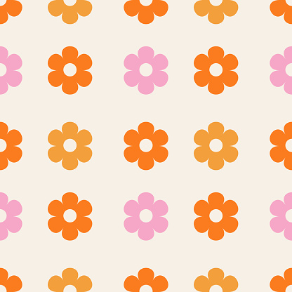 Vector seamless pattern features a playful and colorful floral print. Pattern with flowers in orange, pink, and yellow colors.