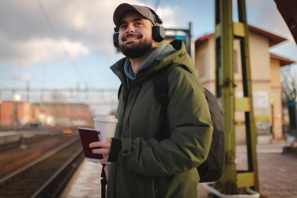 istock Smiling man waiting for the train 2060889923