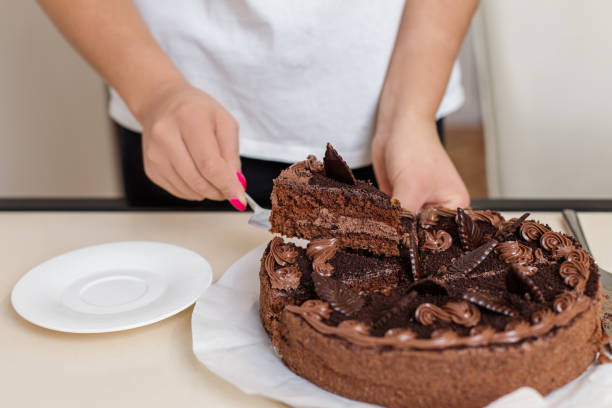 istock Serving a Slice of Elegant Chocolate Cake 2060892106