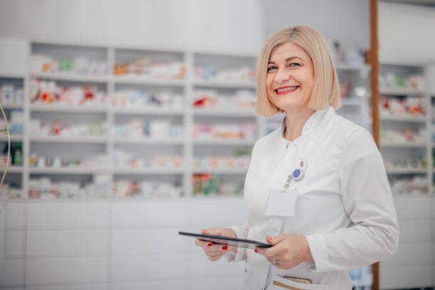 istock Woman Pharmacist Working at Pharmacy 2060900484
