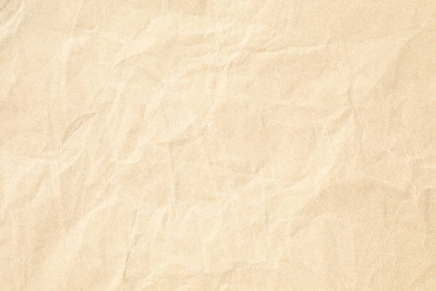istock Brown crumpled paper texture with grains macro closeup 2060906588