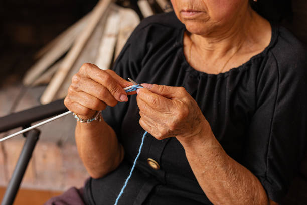 istock Yarn tales. Senior weaves warmth into every stitch. 2060907648