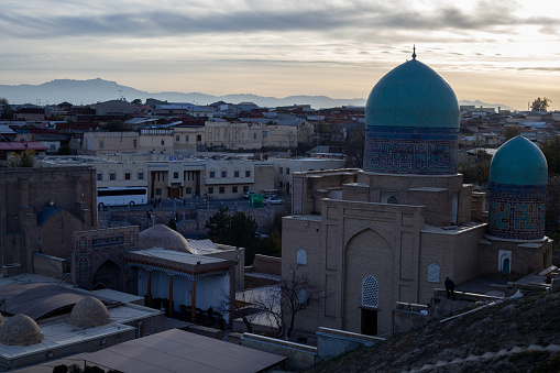 Panoramic view of the center of Bukhara around the Kalyan minaret (nearly 46 m hight and build in the early 12th century!). The minaret Mir-i Arab Madressa and the Kaylan mosque (both 16th century) are visible. The center of Bukhara (also calloed Buchara or Buxoro) is listed as UNESCO World Heritage Site. Bukhara was one of the most important oasis and place of caravanserais at the Great Silk Road.