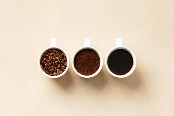 istock Stages of Coffee Preparation in White Cups 2060917059