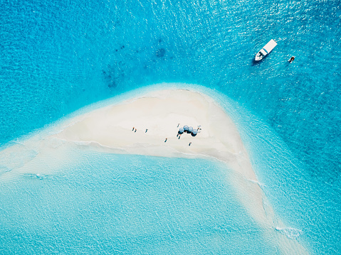 Top down aerial view of seascape atoll sandbank island in Maldives