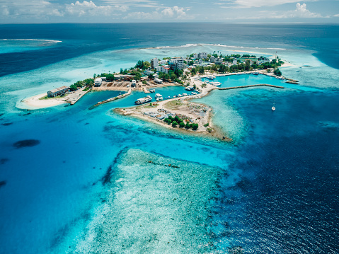 Gulhi island near Maafushi on Kaafu Atoll. Tropical local island with blue ocean on Maldives. Aerial View