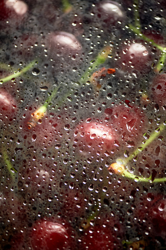 Juicy cherries or cherries in the water under the fogged glass. Vitamins and berries. Juiciness.