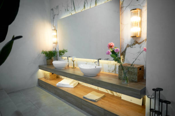 istock Bathroom with large mirror, two sinks and flowers 2060940404