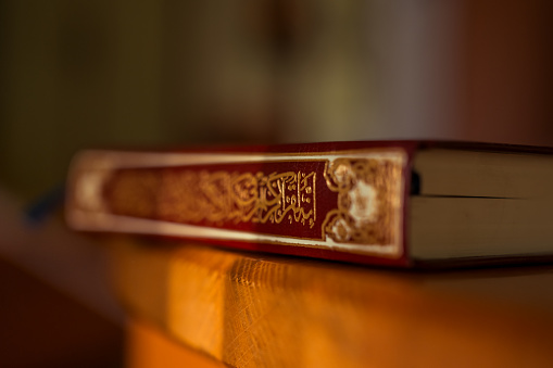 Holy book Quran on wooden background