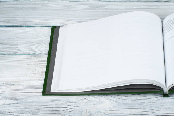 istock Open book on wooden deck table and black board background. Back to School. Education concept with copy space for your ad text. 2060970445