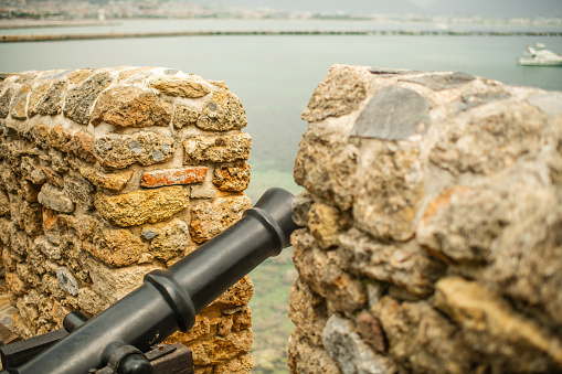 Fortress wall and old cannon in Alanya castle, Turkey