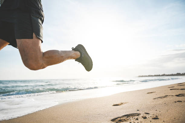 istock Man walking and doing sports on the beach 2061000081