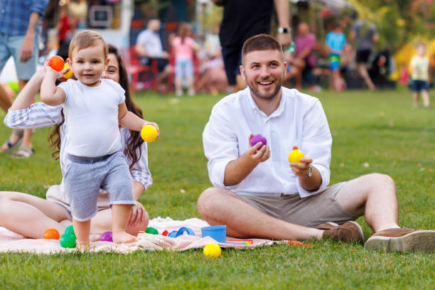 istock Parents paying with child while having picnic in the park 2061002781