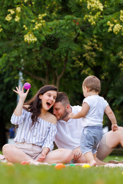 istock Young parents having fun with their little son whille on a picnic 2061003858