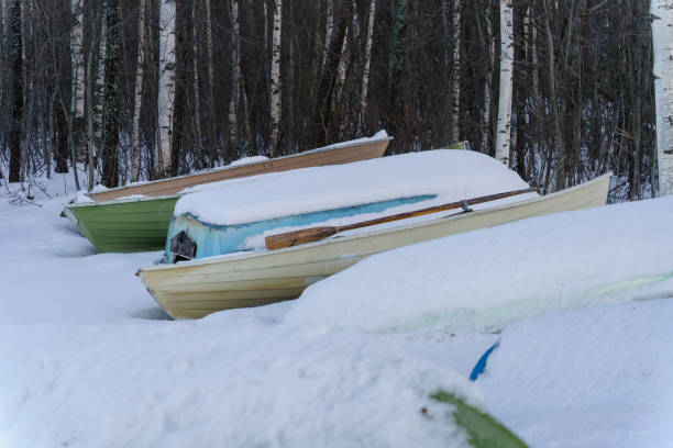 istock Snow covered rowboats on a beach 2061007099