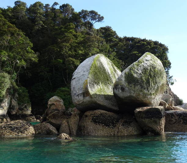 Split Apple bay in Abel Tasman national park, New Zealand. iconic rock split in two
