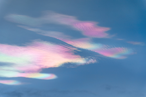 Iridescent clouds (Rainbow clouds) close up in the evening