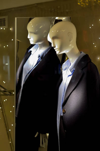 istock Mannequins in shop window. 2061008173
