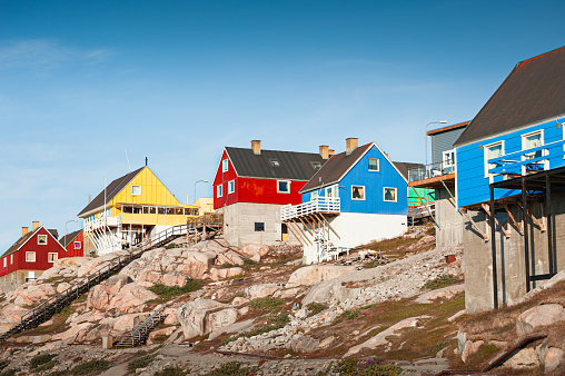 Colorful traditional houses on the rocks in Ilulissat, western Greenland. Summer landscape