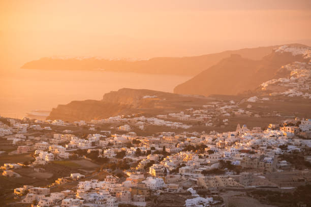 Beautiful pink sunset at Santorini island, Greece. View of Pyrgos village. stock photo