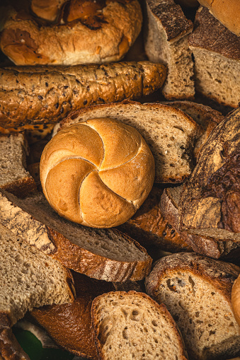 slices of stale bread, pastry and other bakery products in paper bag used as a food for farm animals, poultry and birds, recycling concept, zero waste